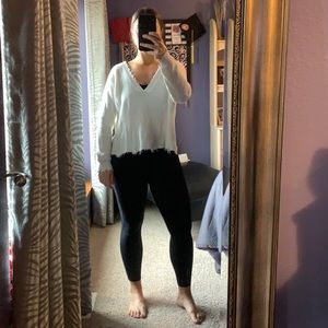 Distressed white sweater